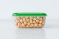 Wet chickpeas in the plastic container