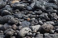 Wet colorful volcanic stones on the shore - Image Royalty Free Stock Photo