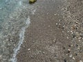 Wet colourful pebbles on the beach