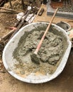 Wet concrete in bucket with shovel Royalty Free Stock Photo
