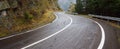 Wet curved alpine road, wide picture. Wet curved alpine road, wide picture. Snaky road Royalty Free Stock Photo