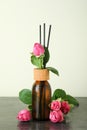 Wet diffuser bottle with sticks and pink Royalty Free Stock Photo