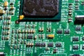 wet digital circuit board with microprocessors and components, closeup full-frame macro background