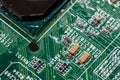 wet digital circuit board with microprocessors and components, closeup full-frame macro background