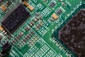 wet digital circuit board with microprocessors and components, closeup full-frame macro background