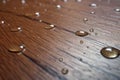 Wet drops on wooden floor water resistance. Generate Ai