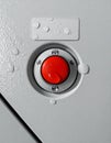 Wet Emergency Stop Button on an Industrial Control Panel Royalty Free Stock Photo