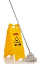 Wet floor sign and mop on white background Royalty Free Stock Photo