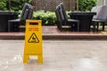 Wet floor warning sign on the floor in hotel corridor Royalty Free Stock Photo