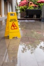 Wet floor warning sign on the floor in hotel corridor Royalty Free Stock Photo