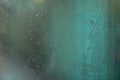 Wet glass on bus window, blurred green scene behind, abstract steamy / dew condensation background Royalty Free Stock Photo