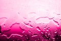 Wet glass surface in drops of water, pink gradient, hot water of high temperature heating, texture of spilled water