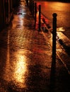 Wet golden street in Paris Royalty Free Stock Photo