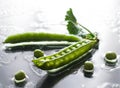 Wet green peas on table water front vegetable macro