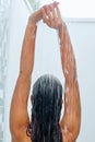 Wet hair. Woman washing her hair with shower. Royalty Free Stock Photo