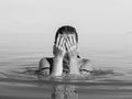 Wet head of a young girl who emerged to the surface of the water Royalty Free Stock Photo