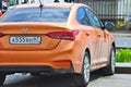 Wet Hyundai Solaris 1.6 Orange in Russia. Royalty Free Stock Photo