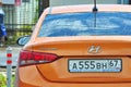 Wet Hyundai Solaris 1.6 Orange in Russia. Royalty Free Stock Photo