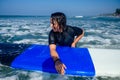 Wet indian woman on surf waiting a big wave in Goa sea Royalty Free Stock Photo