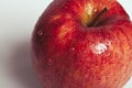 Wet Juicy Red Apple Close-up on white background Royalty Free Stock Photo