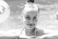 Wet kid face portrait happy smiling in outdoor pool on sunny summer day, girl Royalty Free Stock Photo