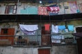 Wet laundry hanging on the balcony rope.