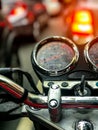 Wet motorcycle panel with traffic in the background