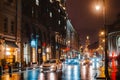 Wet night city street rain Bokeh reflection bright colorful lights puddles sidewalk Car Royalty Free Stock Photo