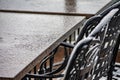 Wet outdoor tables and chairs in close up Royalty Free Stock Photo