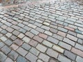 Wet paved with tiles of different colors city street Royalty Free Stock Photo