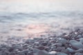 Wet pebble stones and water at morning seaside Royalty Free Stock Photo