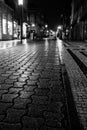 Wet after rain pavement at night in Porto, Portugal. Black and white photo. Royalty Free Stock Photo