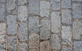 Wet rectangular cobble stone road, texture photographed from above Royalty Free Stock Photo