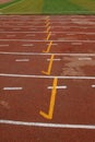 wet red plastic runway in a sports ground Royalty Free Stock Photo