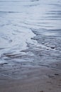 Wet rippled sand and water at the beach abstract background Royalty Free Stock Photo
