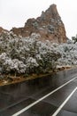 Wet road leading through the garden of the gods colorado springs Royalty Free Stock Photo