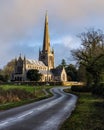 Wet road leading towards Snettisham church (Norfolk, England Royalty Free Stock Photo