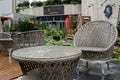 Wet round table in yard before teahouse in rainy morning