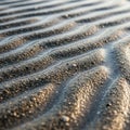 Wet sand create a textured wavy pattern each ridge delicately highlighted Royalty Free Stock Photo