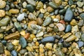 Wet sea pebbles as nature background. Beautiful sea stones of different sizes, colors and texture Royalty Free Stock Photo
