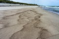 Wet sea sand, deserted sea beach, seashore after rain Royalty Free Stock Photo