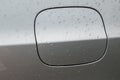 wet silver car tank with rain drops on the surface Royalty Free Stock Photo