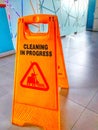 A wet and slippery sign board stands on the workroom floor Royalty Free Stock Photo