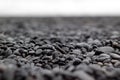 Wet small black stones on a beach Royalty Free Stock Photo