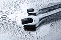 Wet spanners on metal Royalty Free Stock Photo