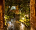 Wet stone path through Japanese garden at night Royalty Free Stock Photo