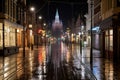 a wet street at night with a church tower in the background