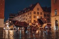 Wet street of the old town in wroclaw in poland with horse and carriage