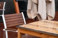 Wet table and armchair in an outdoor cafe in the rain, autumn 2020, background, Moscow Royalty Free Stock Photo