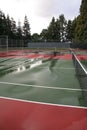 Wet tennis court after rain Royalty Free Stock Photo